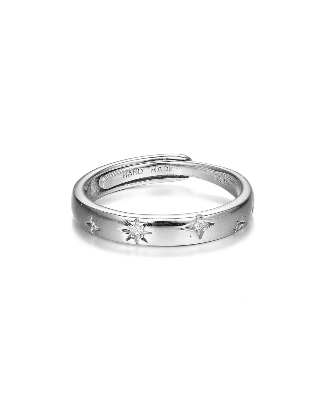 Silver ring with star designs on a white background