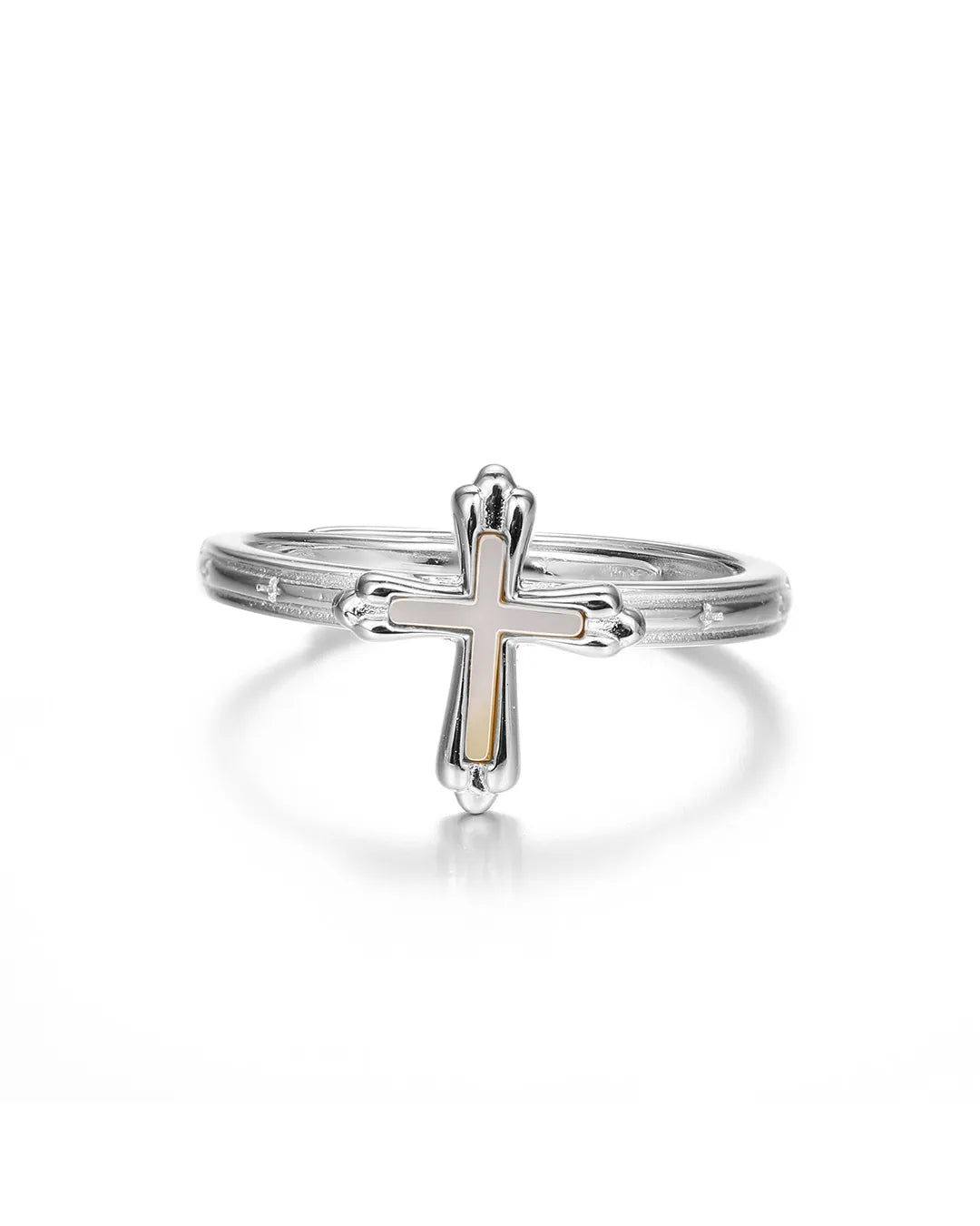 Silver cross ring on a white background