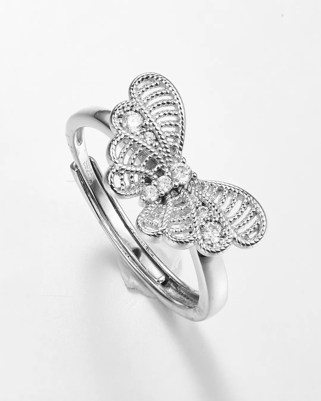 Silver butterfly ring on a white background