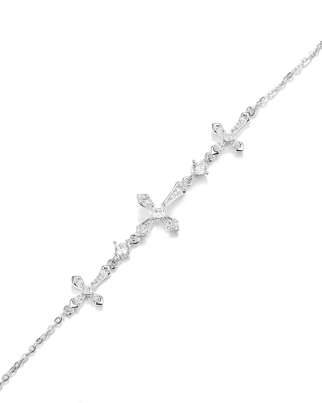 Silver cross necklace on a white background