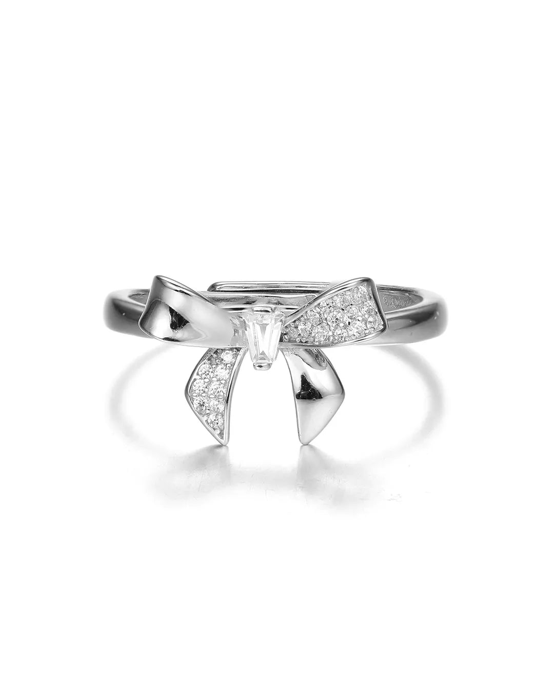 Silver bow-shaped ring with a clear gemstone on a white background
