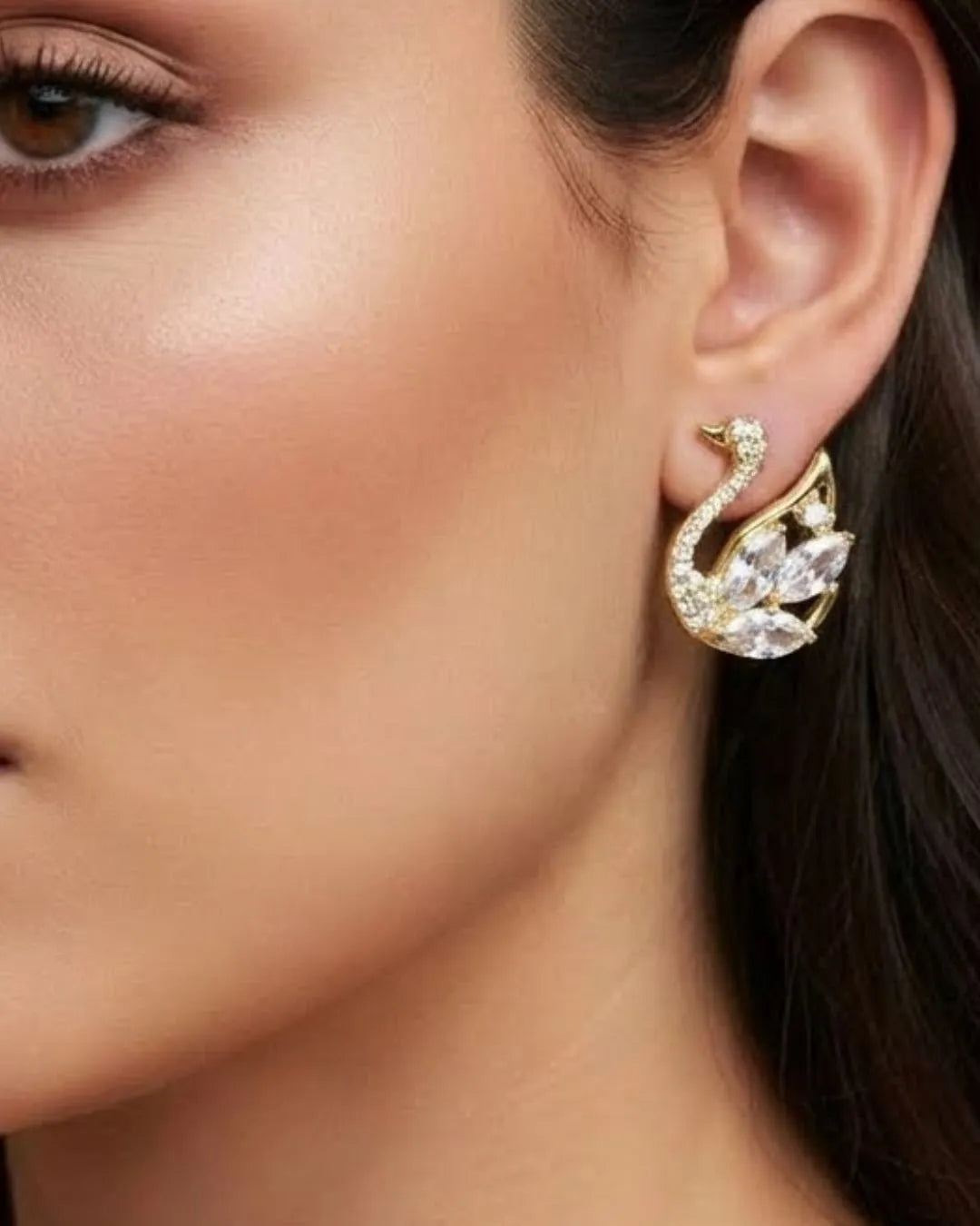Stunning Blue Earrings Featuring a Detailed Crystal Swan Motif