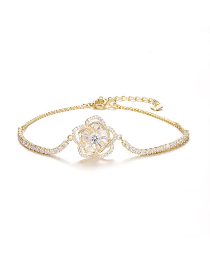 Gold bracelet with a diamond on a white background