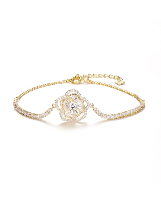 Gold bracelet with a diamond on a white background