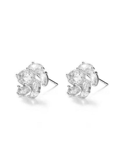 Pair of silver earrings with clear gemstones on a white background