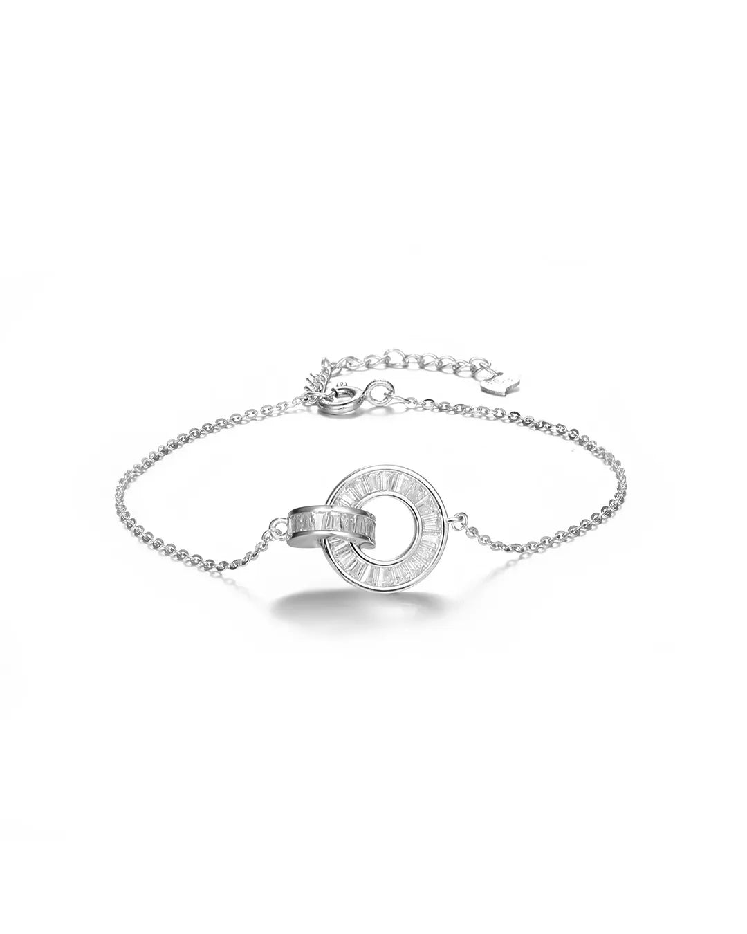 Silver bracelet with a circular design on a white background