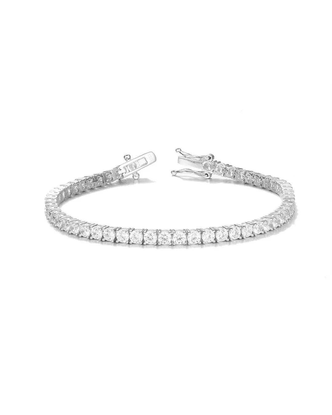 Silver bracelet with clear stones on a white background