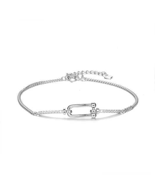 Silver bracelet with a unique clasp design on a white background