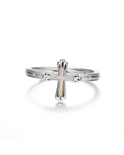 Silver cross ring on a white background