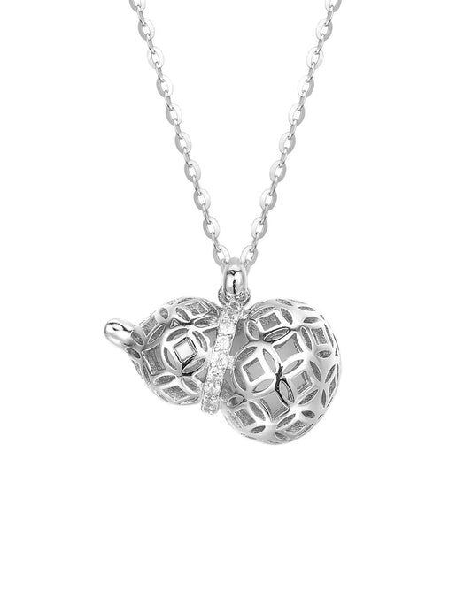 Silver necklace with a heart-shaped pendant on a white background