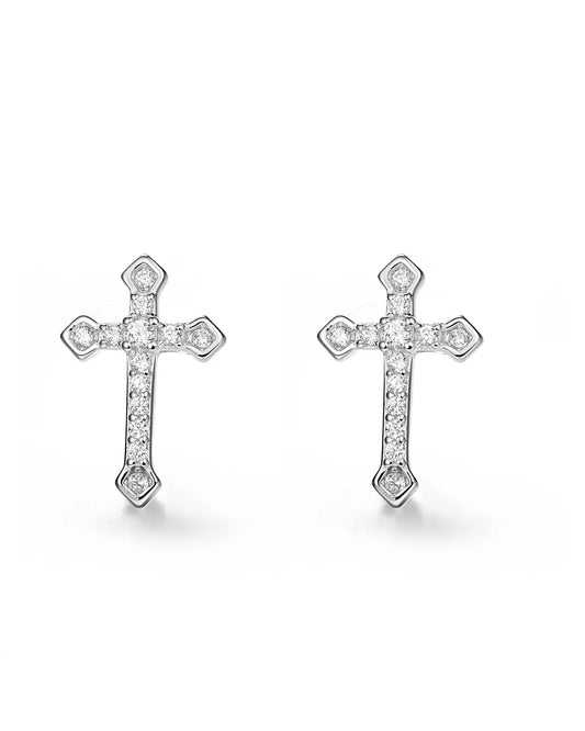 Pair of silver cross earrings with clear stones on a white background