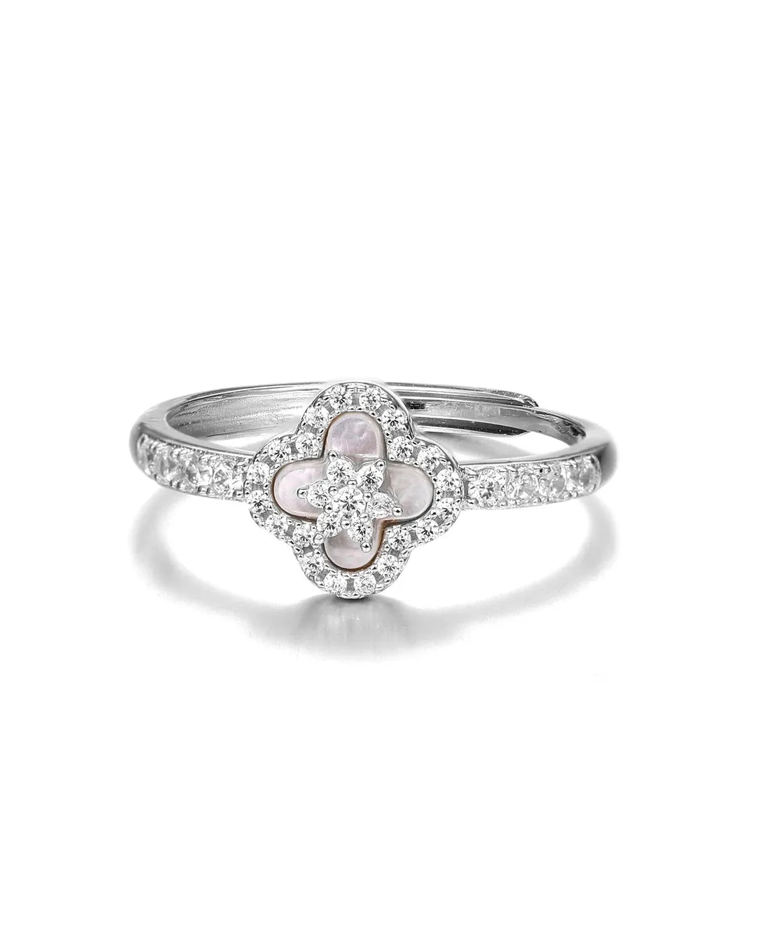 Silver ring with a clover-shaped center and diamond accents on a white background