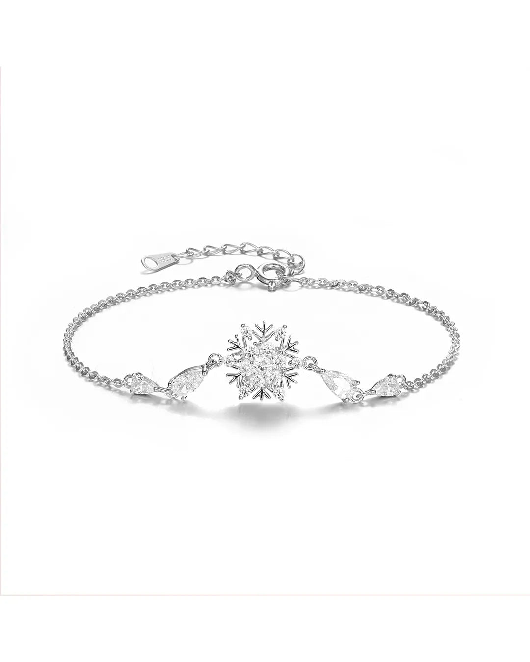 Silver bracelet with a snowflake design on a white background