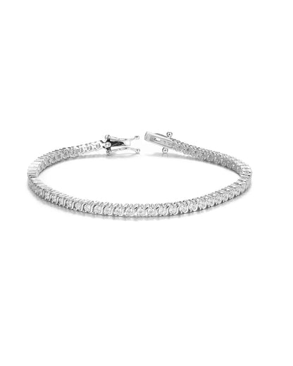Silver bracelet with clear stones on a white background