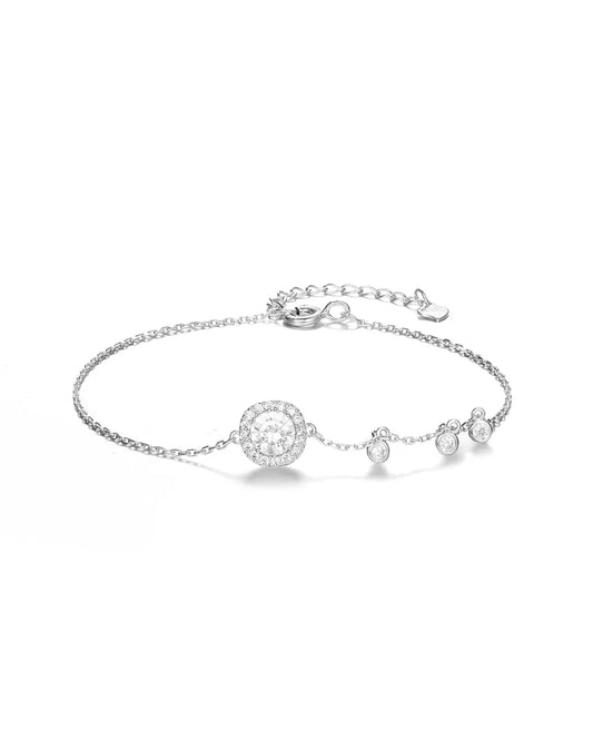 Silver bracelet with round charms on a white background