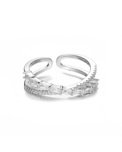 Silver ring with clear gemstones on a white background