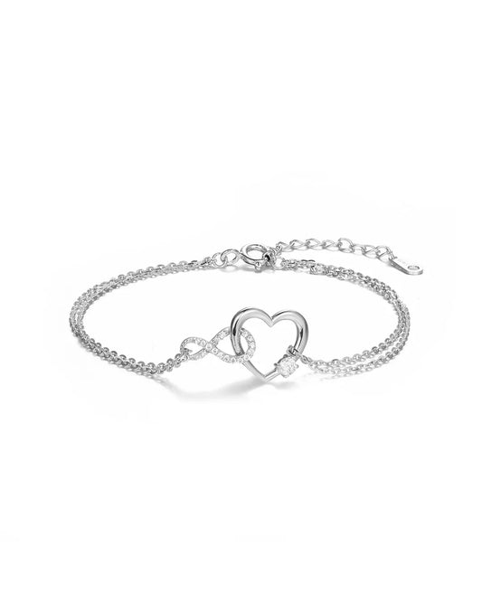 Silver bracelet with a heart-shaped clasp on a white background