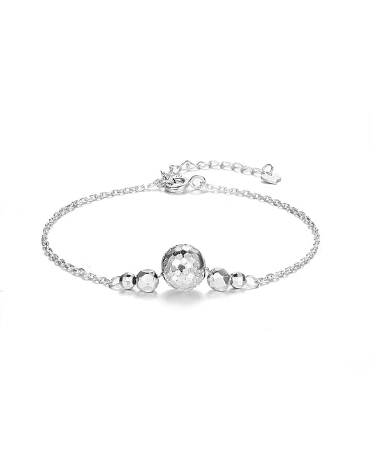 Silver bracelet with spherical beads on a white background