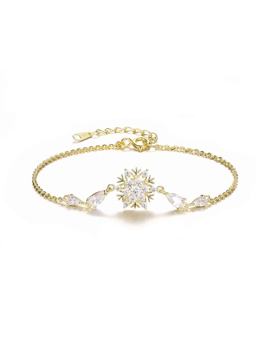 Gold bracelet with snowflake design and clear crystals on a white background