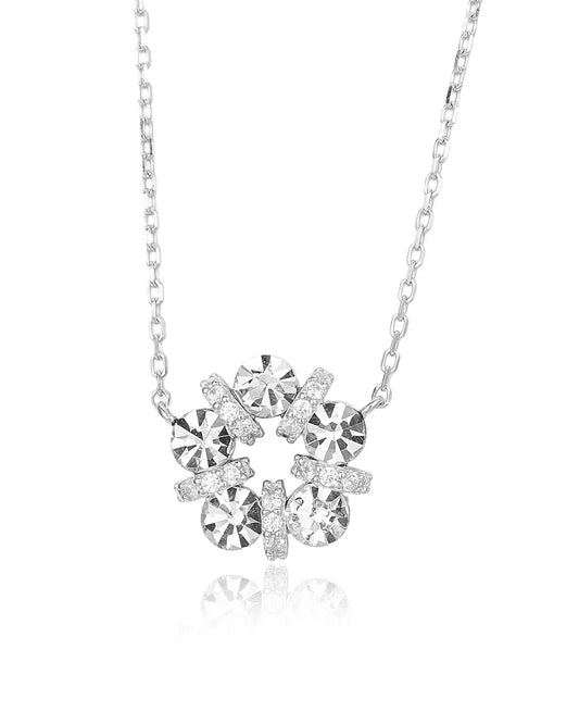 Silver necklace with a floral pendant featuring clear crystals on a white background