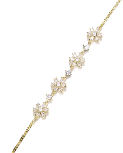 Gold necklace with floral design on a white background