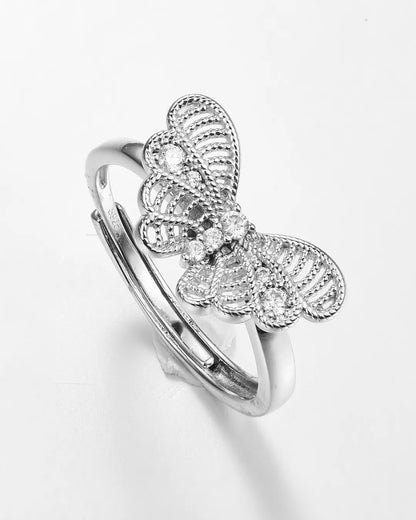 Silver butterfly ring on a white background