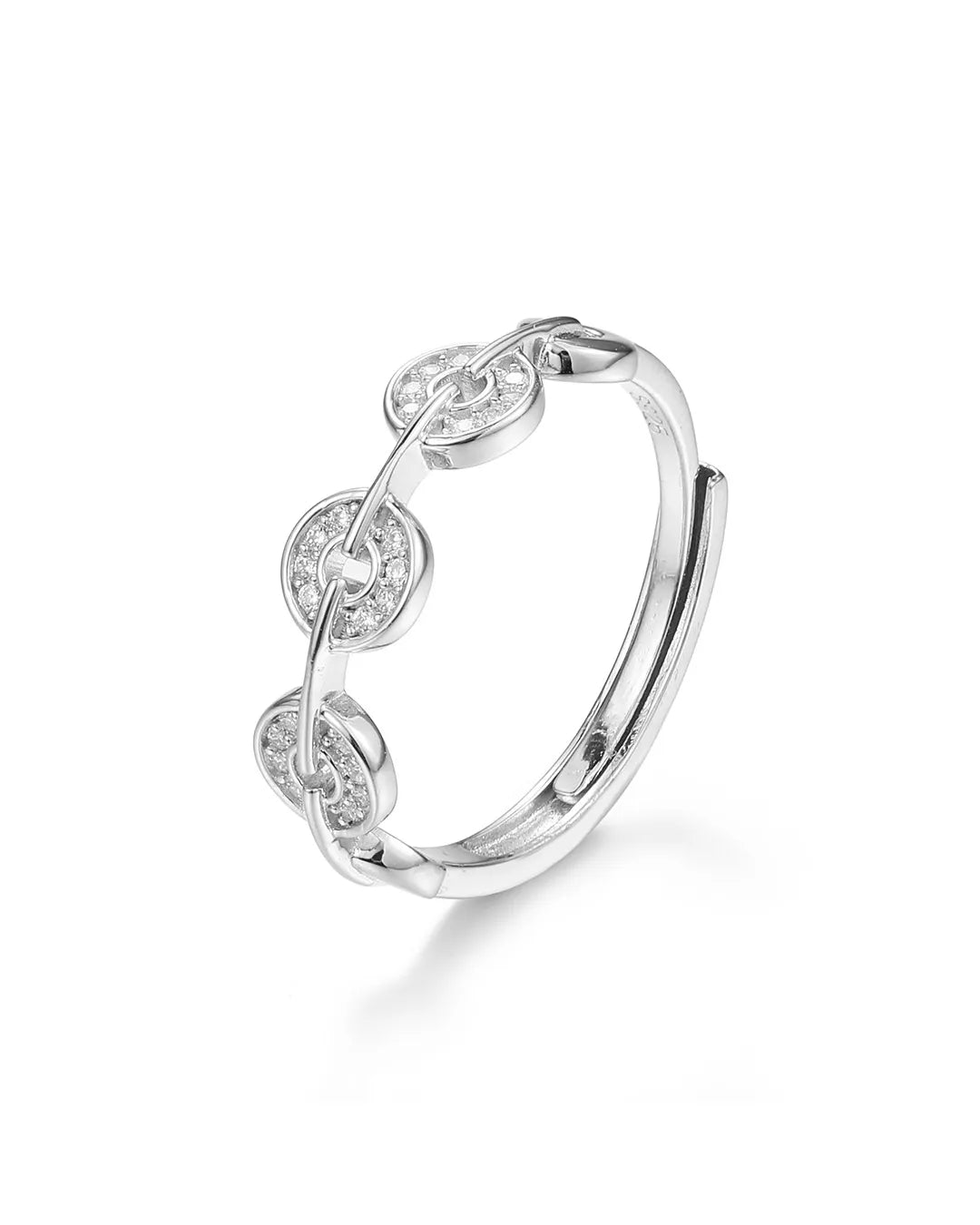 Silver ring with intricate design on a white background