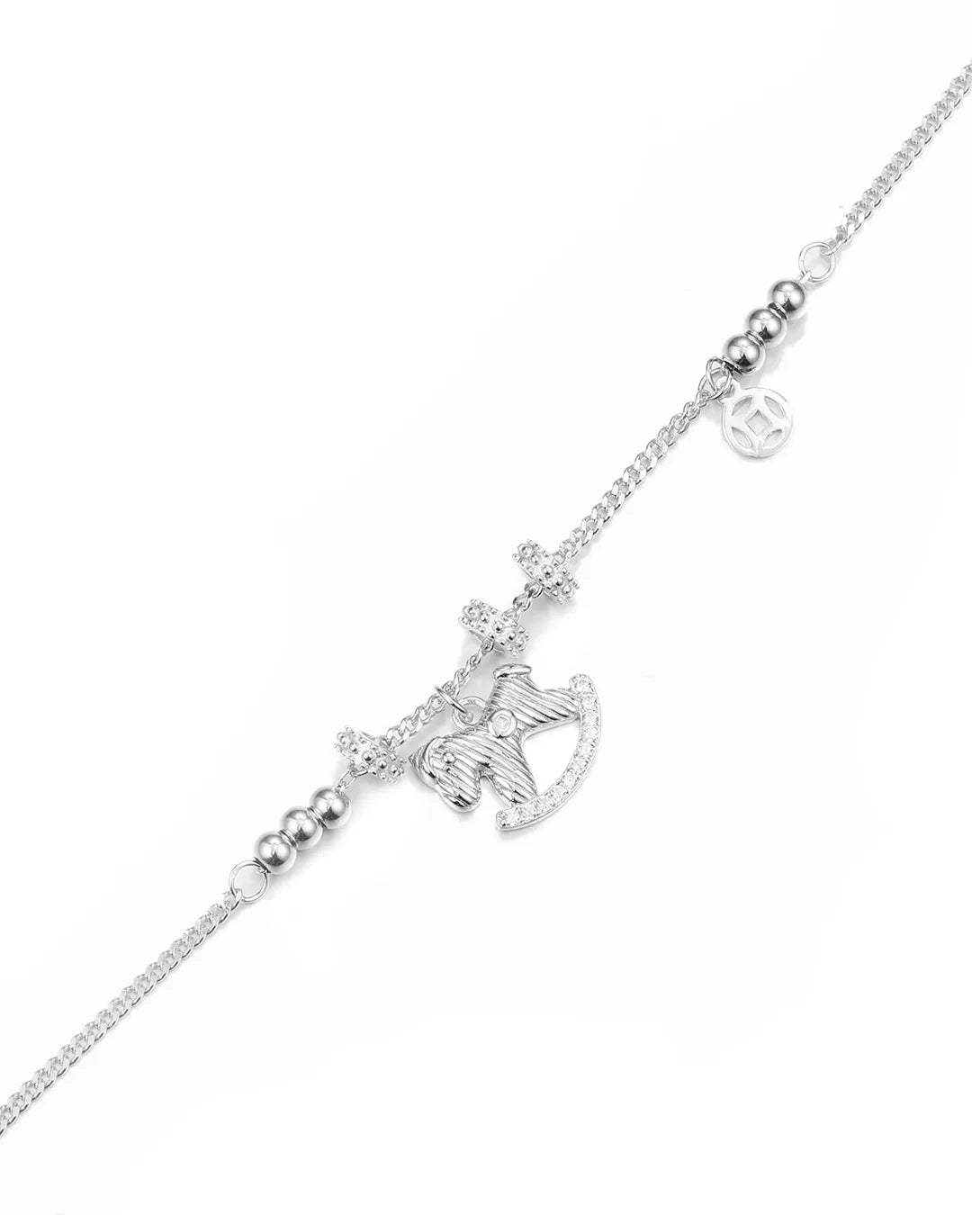 Silver bracelet with a bow-shaped clasp on a white background