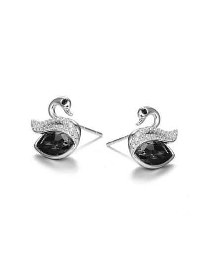 Swan-shaped earrings with black gemstones on a white background