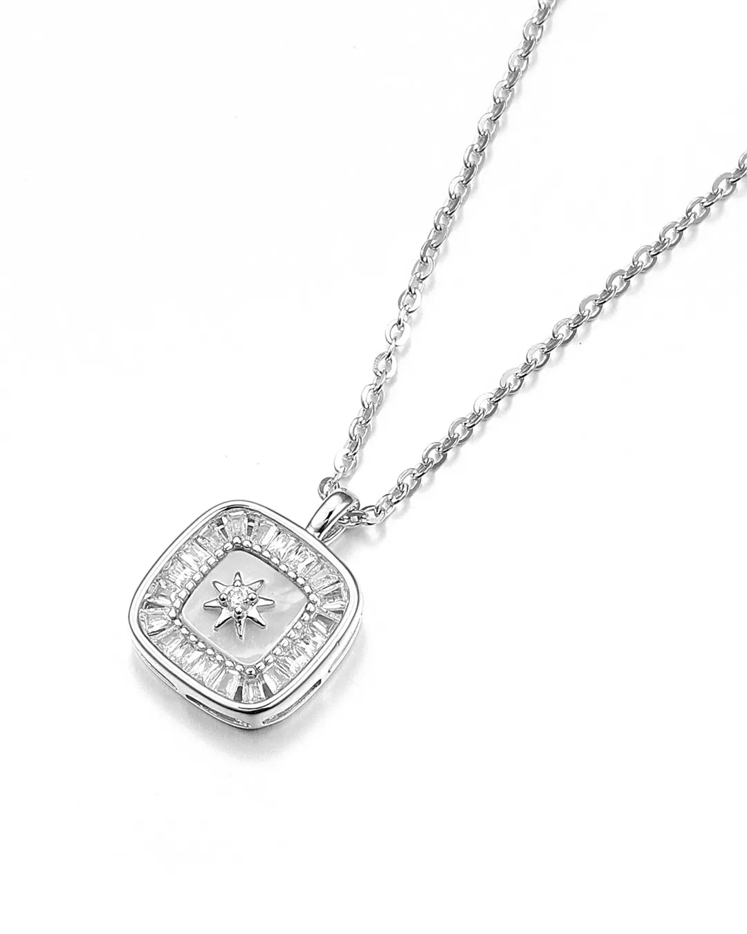 Silver necklace with a square pendant on a white background