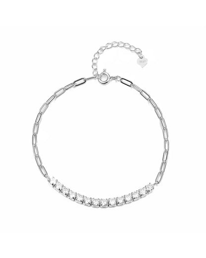 Silver bracelet with clear stones on a white background