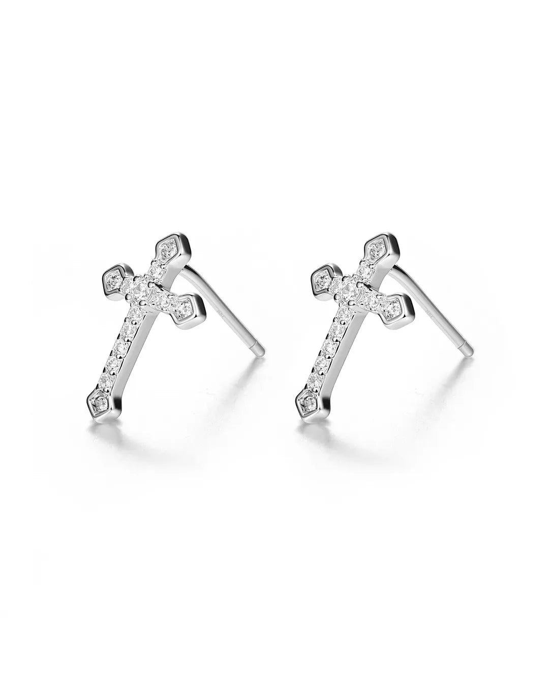 Pair of silver cross-shaped earrings with small diamonds on a white background