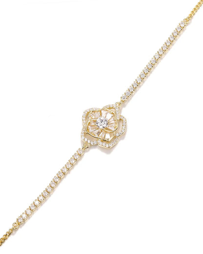 Gold bracelet with diamond accents on a white background