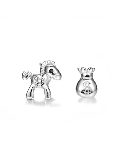 Silver horse and money bag earrings on a white background