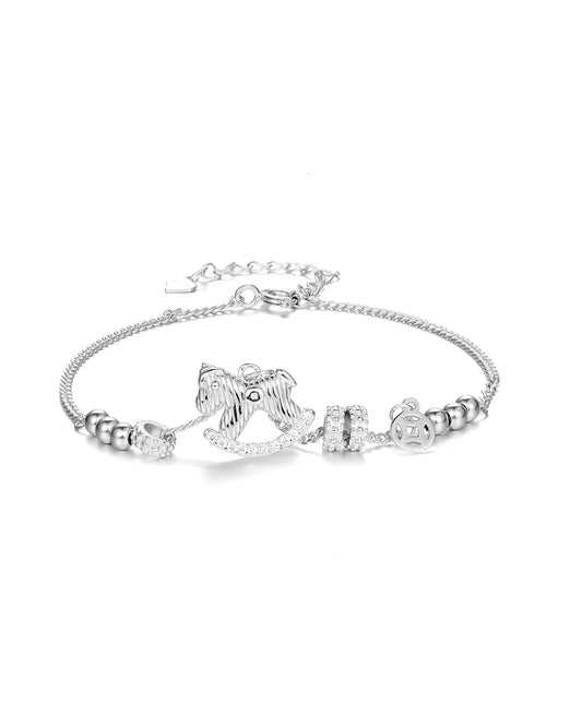 Silver bracelet with horse charm on a white background