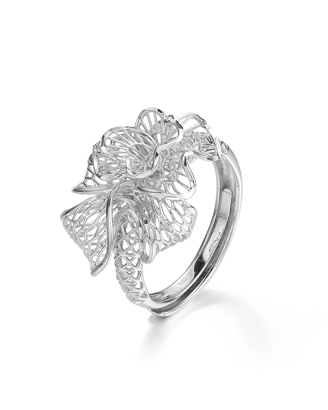 Silver ring with floral design on a white background