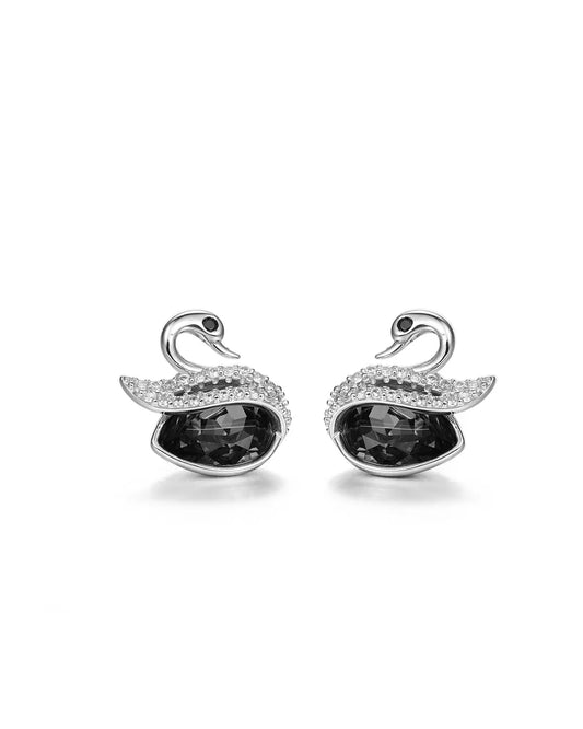 Swan-shaped earrings with black gemstones on a white background
