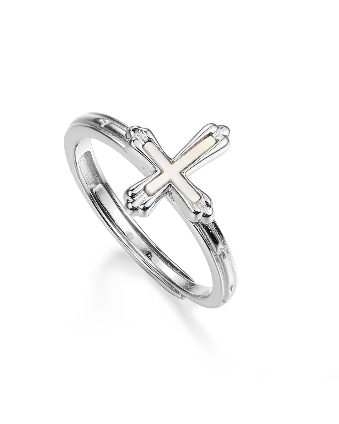 Silver ring with a cross design on a white background