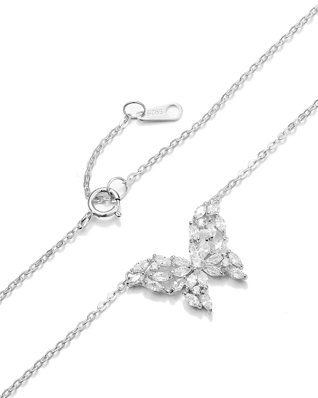 Silver butterfly necklace with clear gemstones on a white background