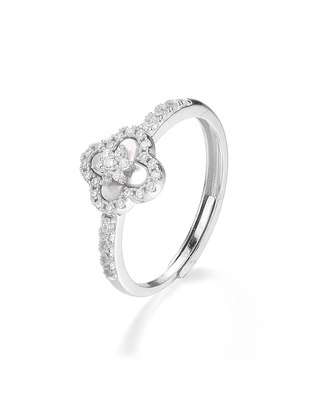 Silver ring with a heart-shaped diamond design on a white background