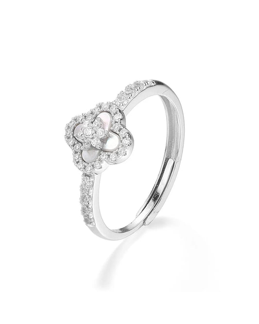 Silver ring with a heart-shaped diamond design on a white background