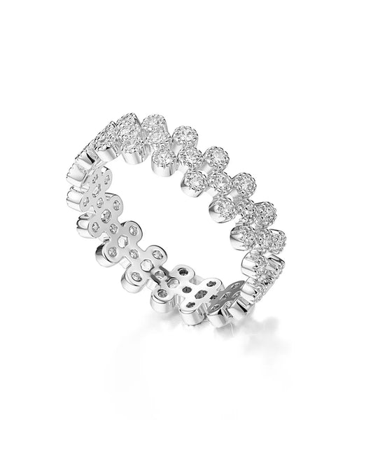 Silver ring with floral design on a white background