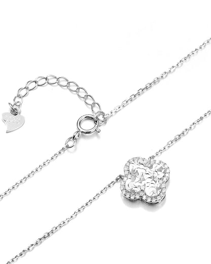 Silver necklace with a heart-shaped clasp on a white background