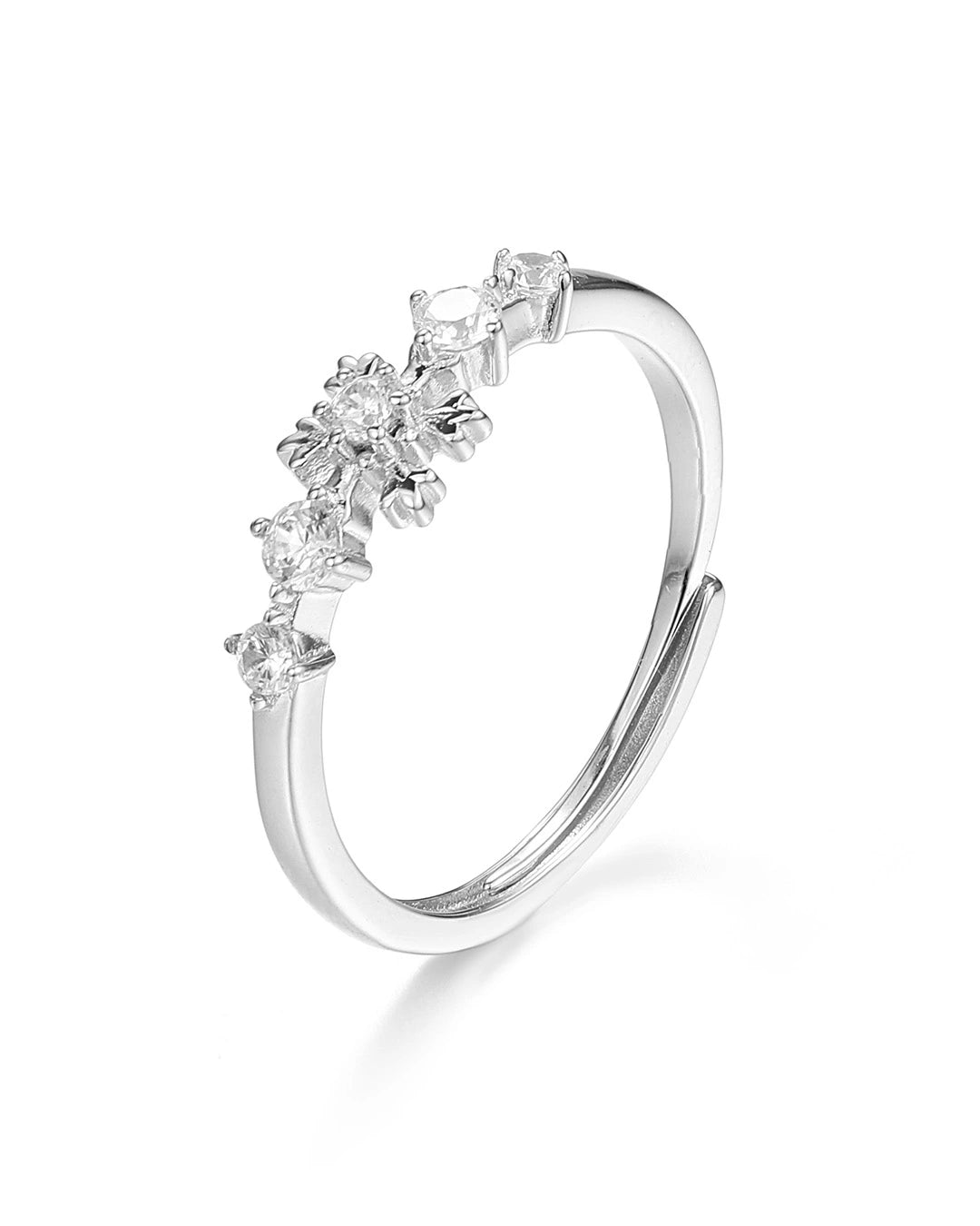 Silver ring with diamond-like stones on a white background