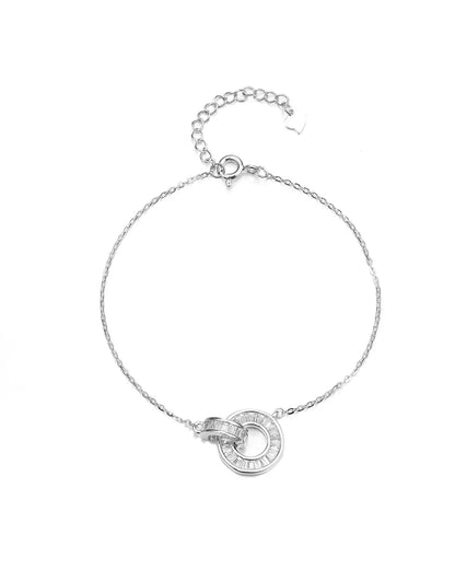 Silver bracelet with a circular design on a white background