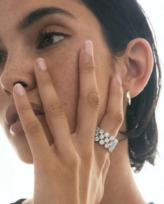 Close-up of a woman wearing a diamond ring on her finger