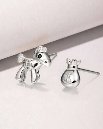 Silver horse-shaped earrings on a light background