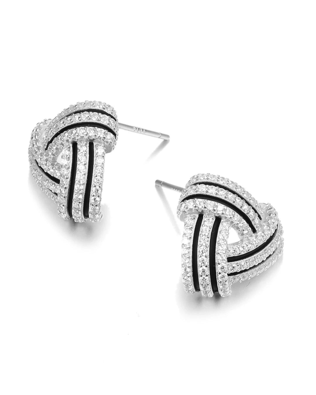 Pair of knot-shaped earrings with black accents on a white background
